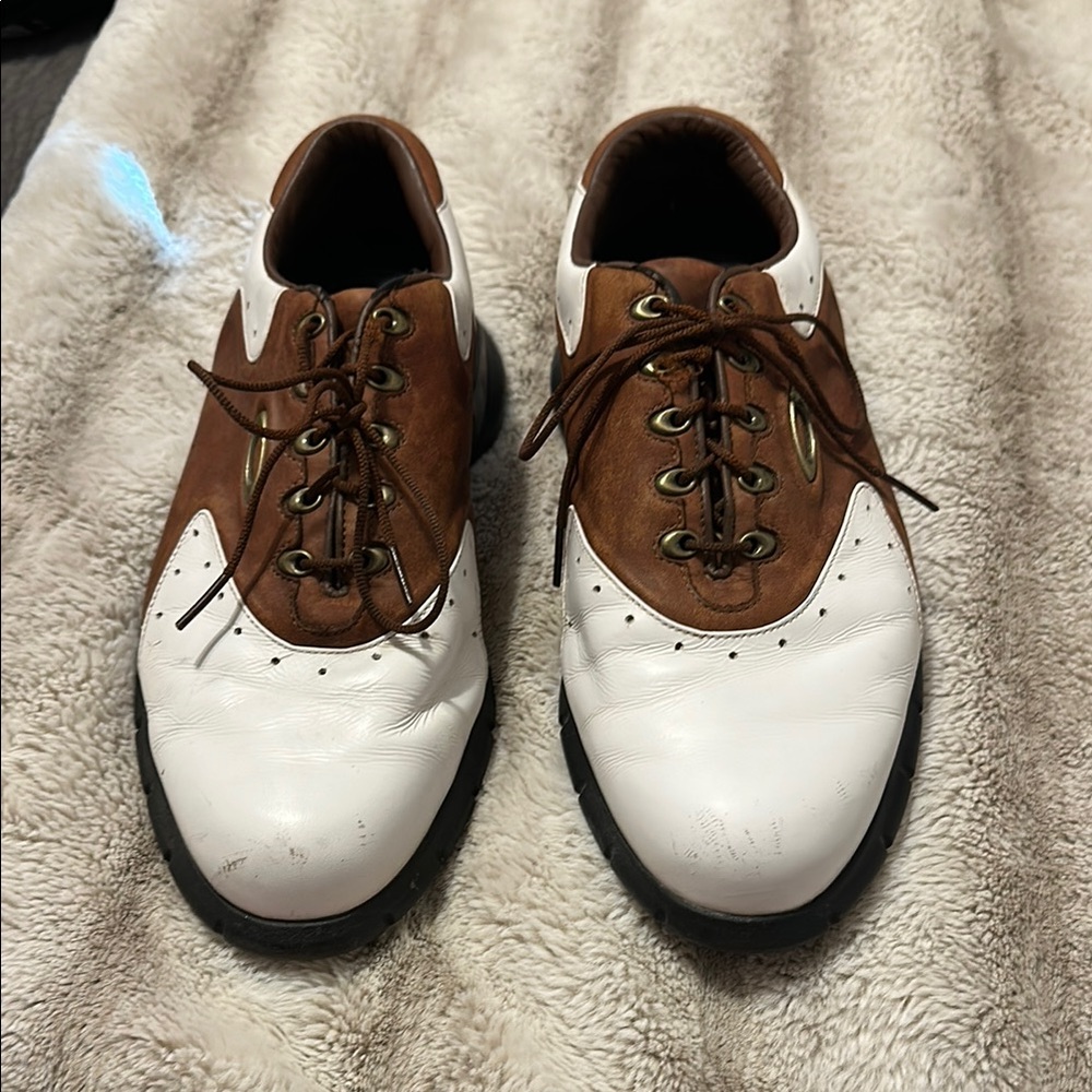 Oakley Brown and White Men's Oxford golf shoes.